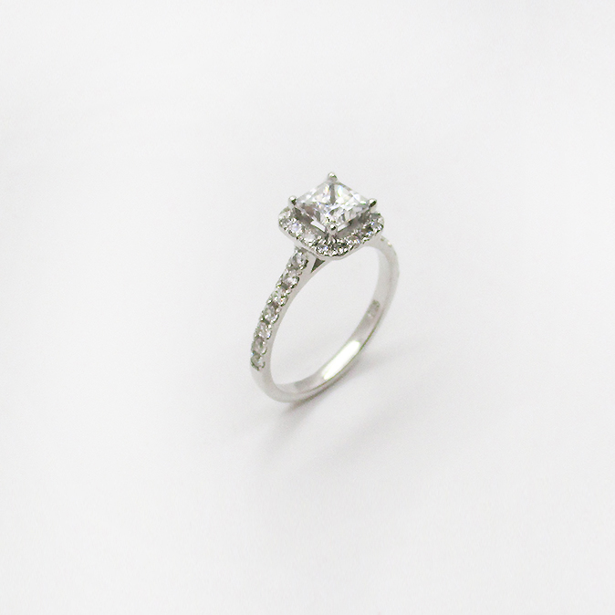 18ct white gold ring set with a princess cut centre diamond, surrounded with princess cut diamonds